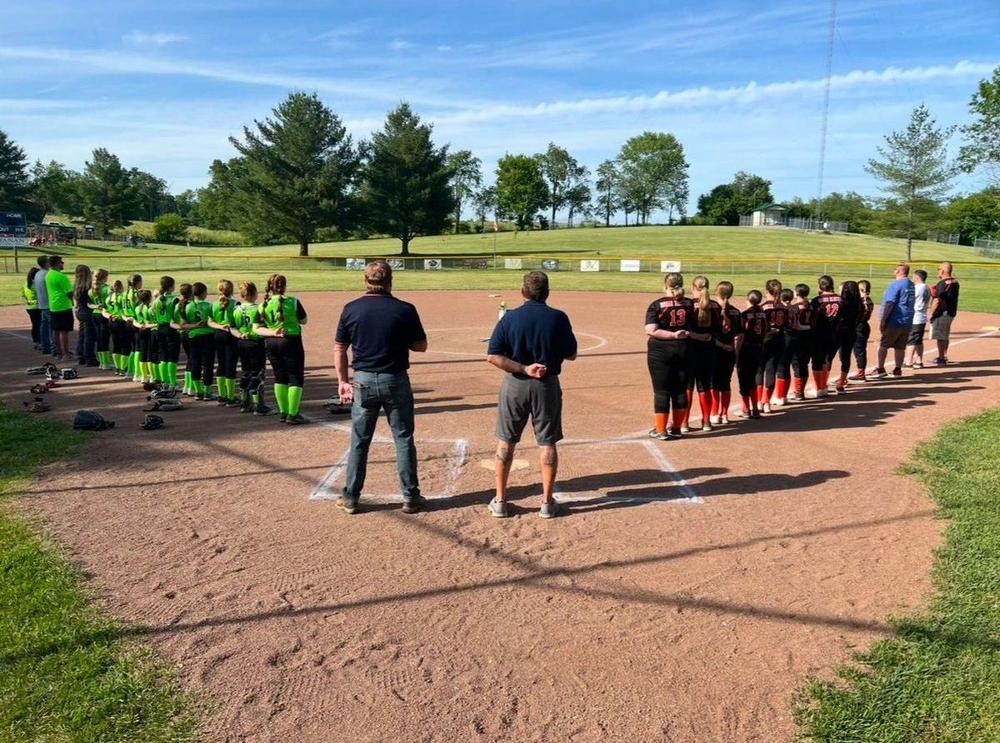 Winchester Little League teams lined up along the baselines before a game.