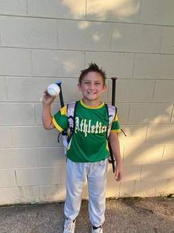 A Winchester Little League softball player on the field in 2023.