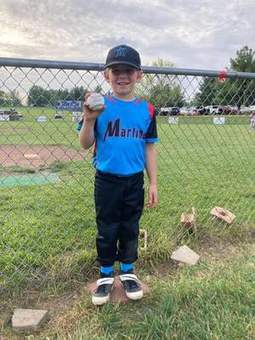 A Winchester Little League player taking a swing during batting practice in 2023.