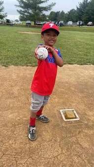 A young Winchester Little League pitcher on the mound during a 2023 game.