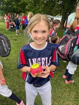 A Winchester Little League player on the field under the lights in 2023.