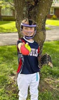 A young Winchester Little League player running to first base in 2023.