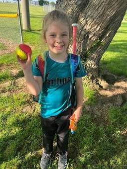 A young Winchester Little League player with a bat in 2023.