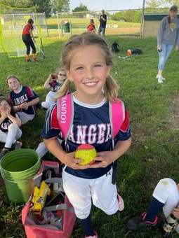 A young Winchester Little League player in the dugout in 2023.